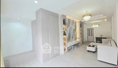 Elegant living room with modern decor and luxurious chandeliers