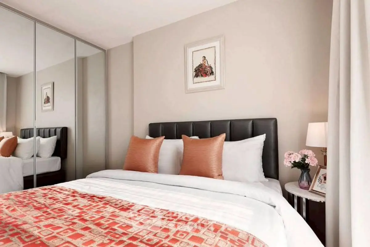 Cozy bedroom with stylish decor and mirrored wardrobe