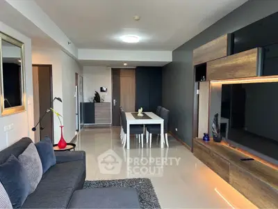Modern living room with sleek furniture and stylish decor in a contemporary apartment.