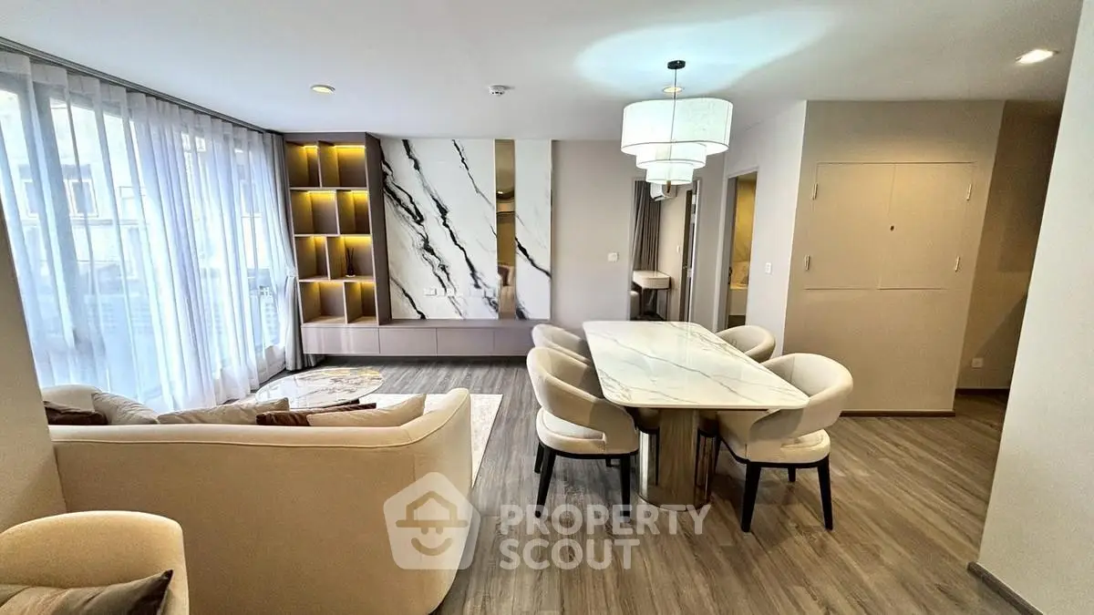 Luxurious modern living room with elegant dining area and stylish decor