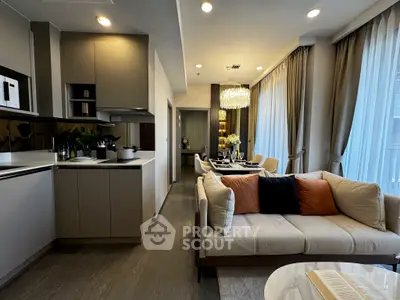 Luxurious open-plan living room with modern kitchen and elegant dining area