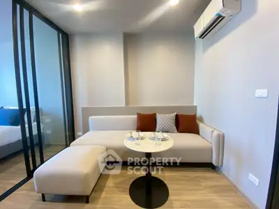 Modern living room with sleek design and cozy seating area