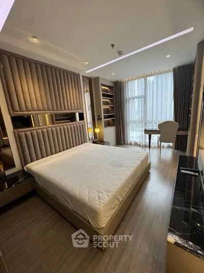 Luxurious bedroom with modern decor and large window view