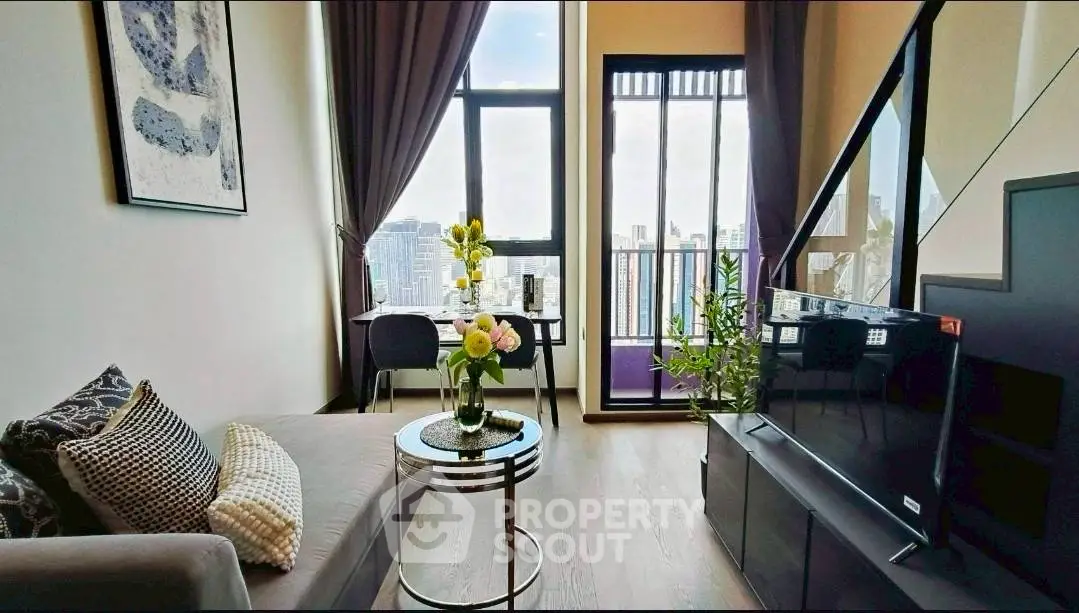 Modern living room with city view, stylish decor, and natural light