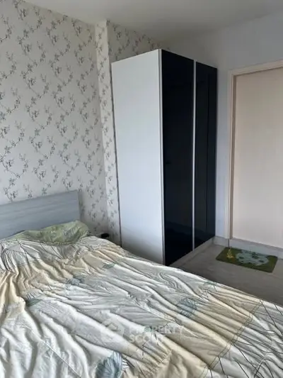 Cozy bedroom with floral wallpaper and modern wardrobe