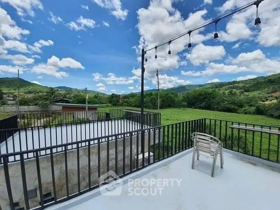 Stunning rooftop terrace with panoramic mountain views and stylish outdoor seating.