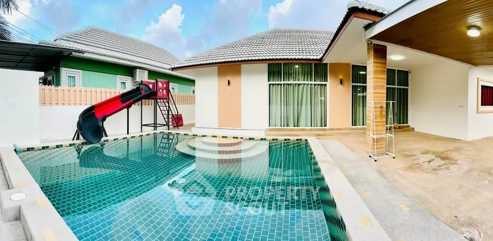 Stunning modern home with private pool and slide, perfect for family fun and relaxation.