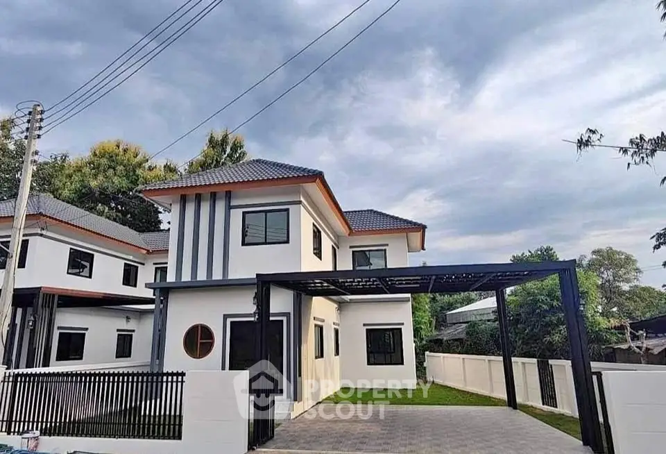Modern two-story house with sleek design and spacious driveway