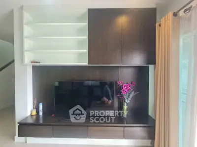 Modern living room with sleek TV unit and elegant decor