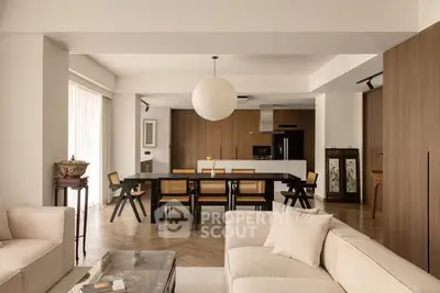 Spacious open-plan living room with modern kitchen and elegant decor