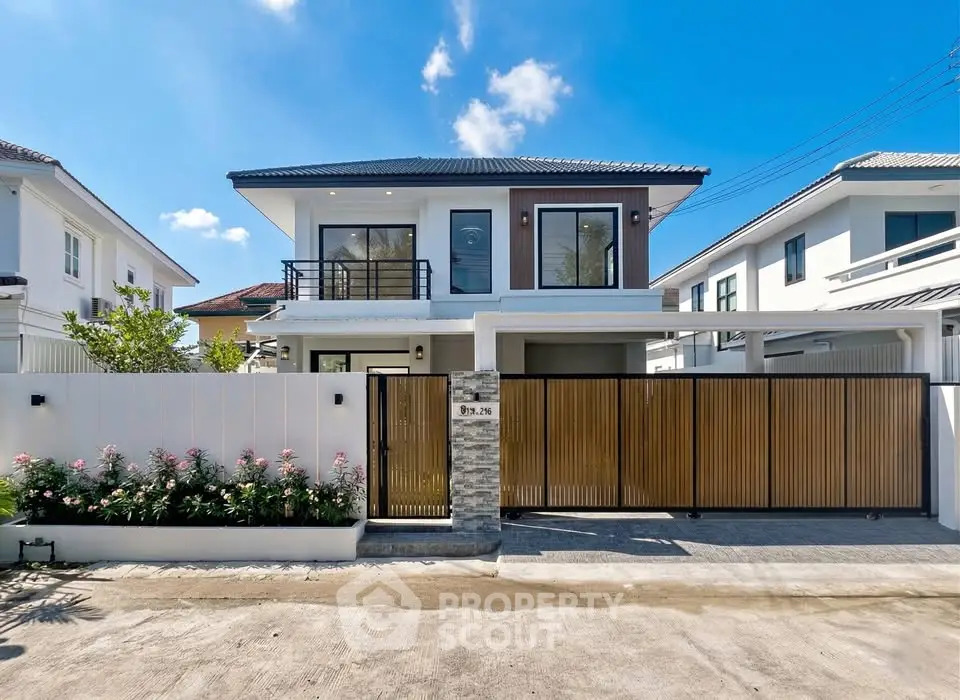 Modern two-story house with sleek design and spacious driveway in a serene neighborhood.