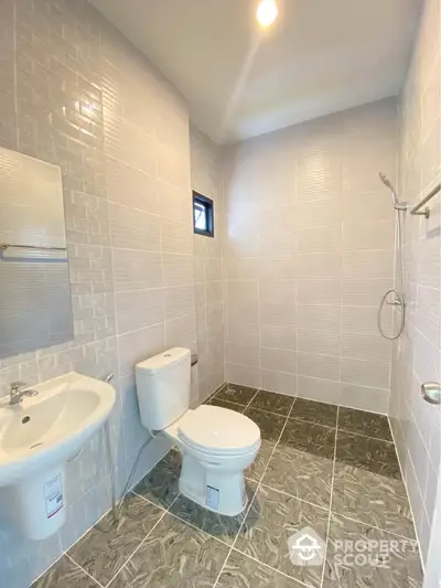 Modern bathroom with sleek tiles and minimalist fixtures