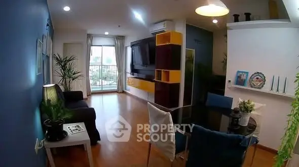 Stylish modern living room with vibrant decor and large window view