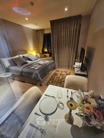 Luxurious bedroom with elegant dining setup and cozy lighting, perfect for modern living.