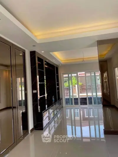 Luxurious modern living room with glossy floors and large windows