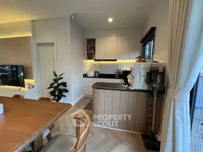 Modern kitchen with open layout and stylish dining area