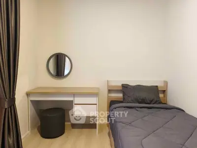 Cozy minimalist bedroom with single bed and study desk