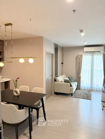Modern open-plan living and dining area with stylish decor and natural light