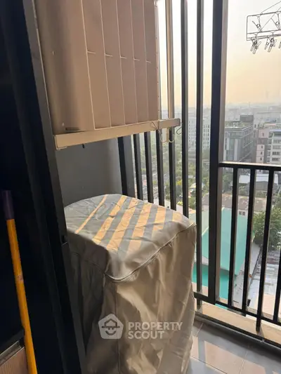 Charming balcony with city view, perfect for relaxation and enjoying sunsets.