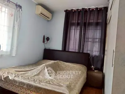 Cozy bedroom with air conditioning and elegant curtains