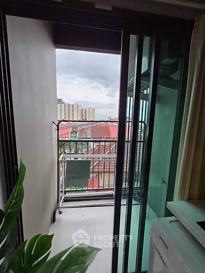 Charming balcony view with cityscape backdrop, perfect for relaxation and enjoying urban living.