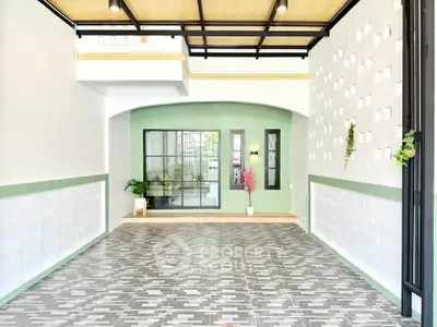 Stylish modern interior with unique tile flooring and green accents