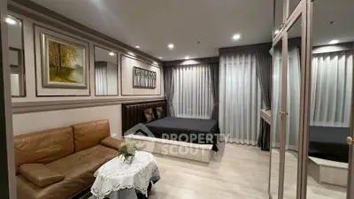 Luxurious bedroom with elegant decor and cozy seating area, perfect for relaxation and comfort.