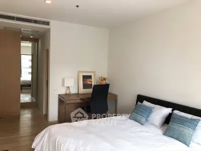 Modern bedroom with study desk and stylish decor in a bright apartment