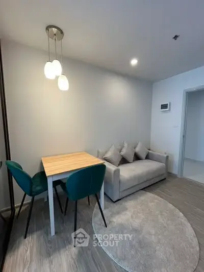 Modern living room with cozy sofa and dining area in stylish apartment.