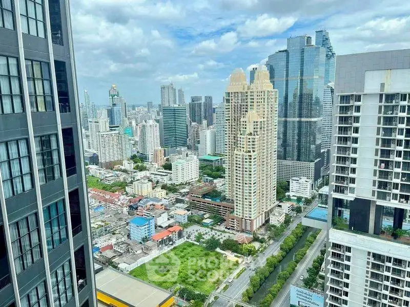 Stunning cityscape view from high-rise building showcasing urban skyline and architecture.