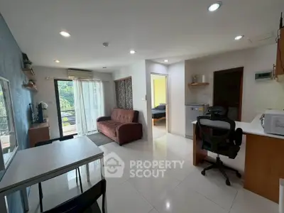 Modern open-plan living room with balcony and natural light