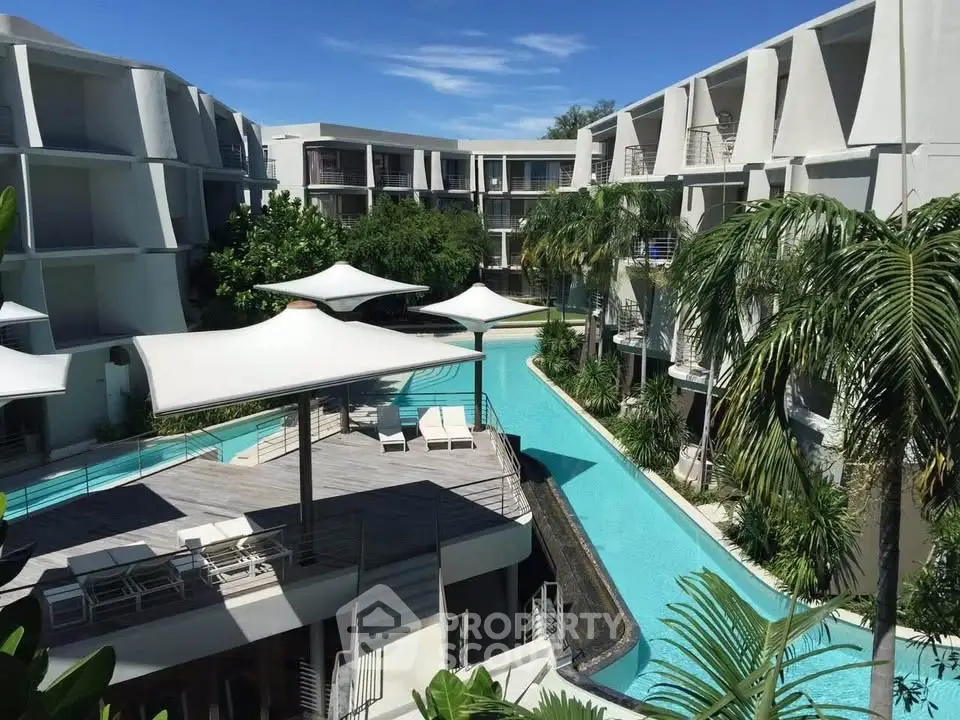 Luxurious resort-style apartment complex with stunning pool and modern architecture.