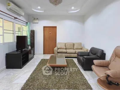 Spacious living room with modern furniture and natural light