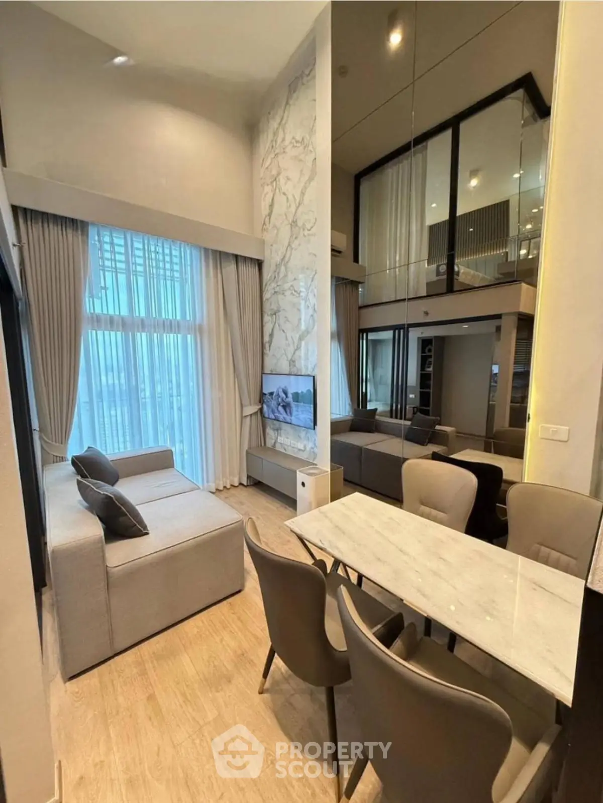 Luxurious modern living room with high ceilings and elegant decor