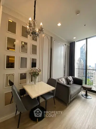 Chic modern living room with city view, elegant decor, and cozy seating area.