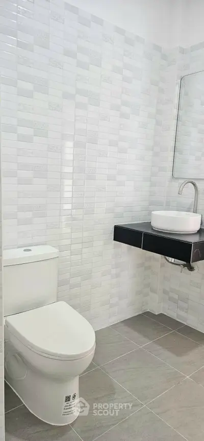 Modern bathroom with sleek fixtures and stylish tile design