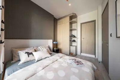 Modern bedroom with stylish decor and ample storage space
