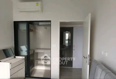 Modern living room with sleek design and air conditioning unit, perfect for comfortable living.