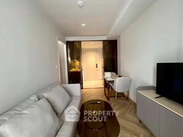 Modern living room with sleek furniture and stylish decor in a contemporary apartment.
