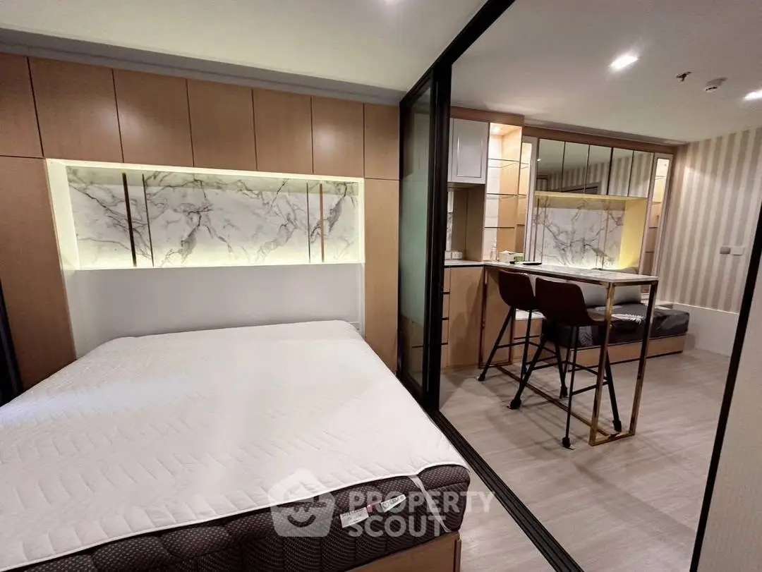 Modern studio apartment with stylish decor and cozy sleeping area