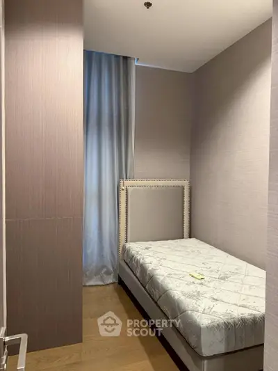 Cozy small bedroom with single bed and elegant decor