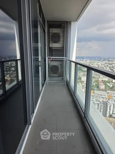 Stunning high-rise balcony with panoramic city views, perfect for urban living enthusiasts.