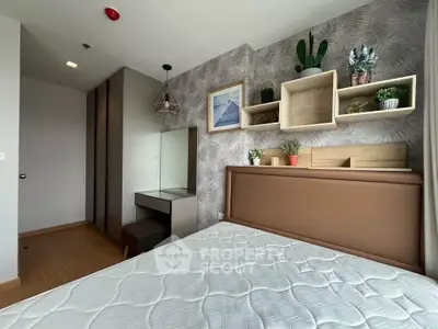 Modern bedroom with stylish decor and ample storage in a contemporary apartment.