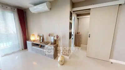 Modern living room with sleek decor and air conditioning unit