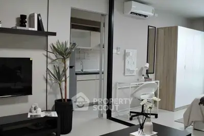 Modern studio apartment with sleek furniture and open kitchen layout