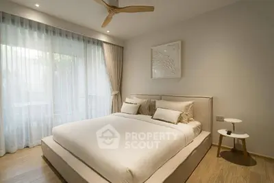 Elegant bedroom with modern decor and natural light, featuring a cozy bed and stylish furnishings.