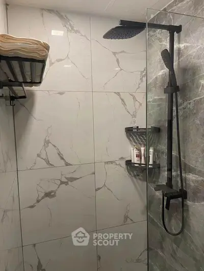 Modern bathroom with sleek shower design and marble tiles