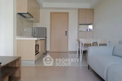 Modern apartment interior with open kitchen and cozy living area