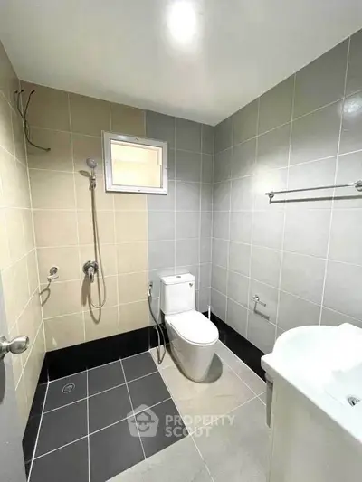 Modern bathroom with sleek tiles and contemporary fixtures