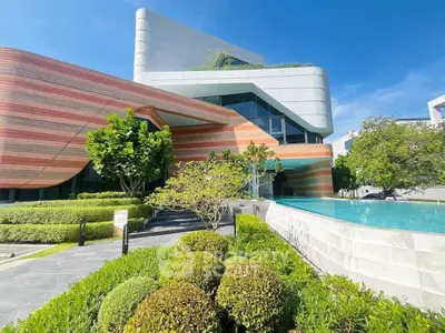 Stunning modern building with unique architecture and lush landscaping